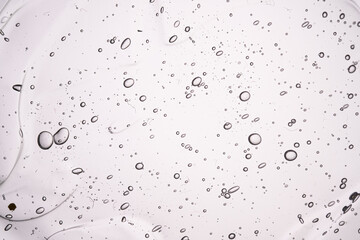 The texture of a thick cosmetic gel on a neutral background.