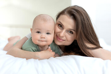 A woman with a small child. Mom with a baby. High quality photo