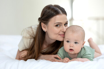 Fototapeta na wymiar A woman with a small child. Mom with a baby. High quality photo