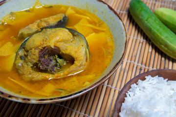 Southern Thai Gaeng Som - Sour catfish soup with bamboo shoots, spicy flavor