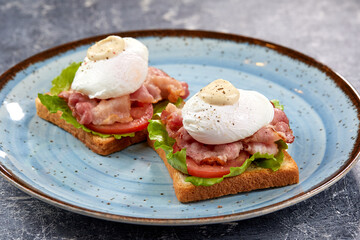 toasts with poached egg and bacon