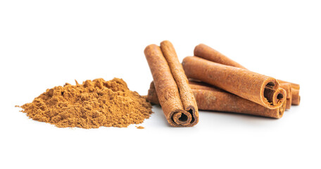 Dry cinnamon sticks and cinnamon powder isolated on white background. Cinnamon spice.