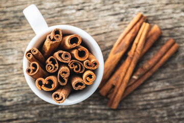 Dry cinnamon sticks on wooden table. Cinnamon spice.