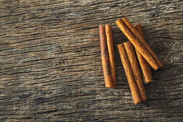 Dry cinnamon sticks on wooden table. Cinnamon spice.