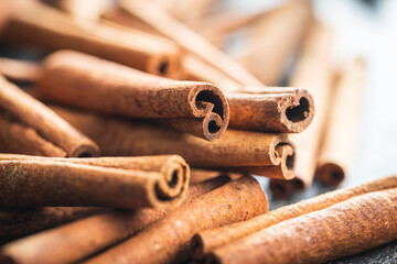 Dry cinnamon sticks on kitchen table. Cinnamon spice.