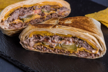 Quesadilla Country Beef. Tortilla, double beef patty, cheese, tomato, pickled cucumber