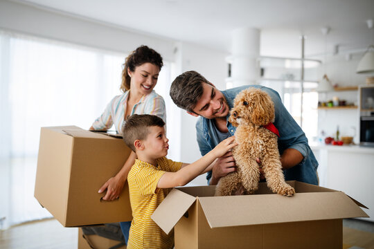 Husband and wife and their son with pet moving in new home.