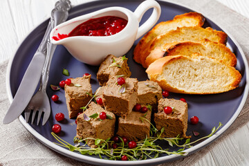 liver pate cubes on plate with toast and berries