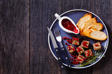 liver pate cubes on plate with toast and berries