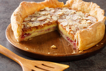 English dessert Bakewell Pudding cake with raspberry jam and filling of egg and almond paste close-up on the table. horizontal