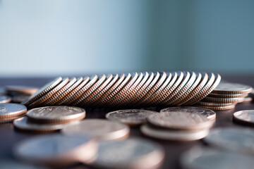 Stack coin on wooden background. pile thai cash and blur floor bank account. plan investment income for 2023 new year. business or finance concept.