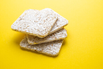 Rice cake on a yellow background close-up.