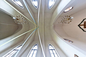 Obraz premium interior dome and looking up into a old gothic or baroque catholic church ceiling with columns