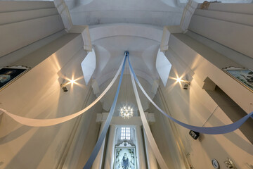 Obraz premium interior dome and looking up into a old gothic or baroque catholic church ceiling with columns