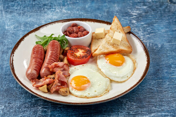 traditional breakfast with egg and sausages