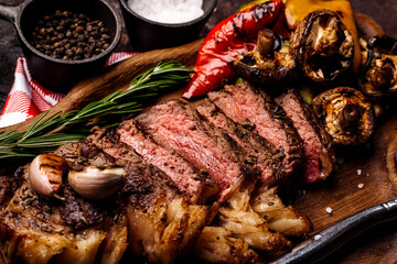Top view of delicious grilled beef steak and vegetables served