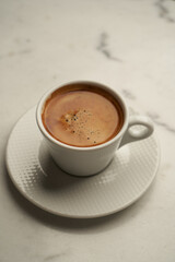 Cappuccino coffee cup on a white table background