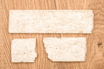 Crispbreads isolated on a wooden background, top view