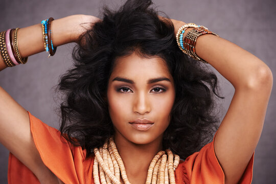 Homegrown beauty. Studio portrait of a beautiful young fashion model posing against a gray background.