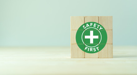 Safety first symbols, work safety, caution work hazards, danger surveillance, zero accident concept. Wooden cubes with smart grey background. Employees safety awareness at workplace. Safety banner.