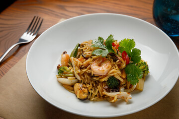 seafood dishes on a wooden table
