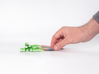 Hand Holding Fiber Optic Cable on isolated white background