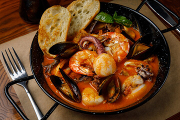 seafood dishes on a wooden table

