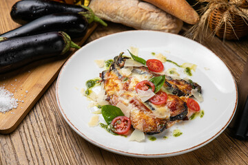 Eggplant dish in a restaurant on a wooden table
