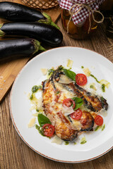 Eggplant dish in a restaurant on a wooden table
