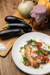 Eggplant dish in a restaurant on a wooden table
