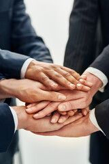 Work together, win together. Cropped shot of businesspeople working in a corporate office.