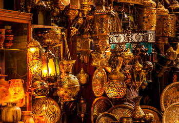 Various arabic antique objects displayed in an old shop in the bazaar. Typical shop in an egyptian market.