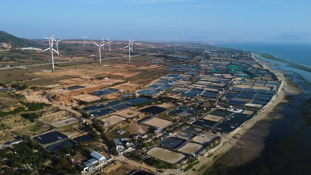 Fisherman town next to shrimp farming giant puddles near Phan rang, Vietnam. Aerial