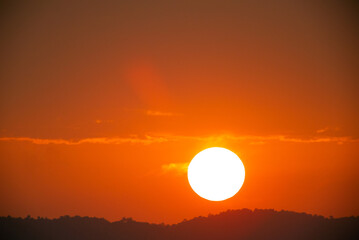 Telephoto lens Close up the sun in sunset Dramatic sky time-lapse 4k. Clouds and Sun Rising Sky Time Lapse. Closeup Telephoto Lens. Travel, Beginning, Nature Concept. Location: Southern of Thailand.