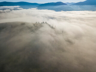 Morning fog in the Ukrainian Carpathians. Aerial drone view.