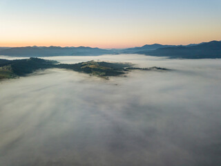 Morning fog in the Ukrainian Carpathians. Aerial drone view.