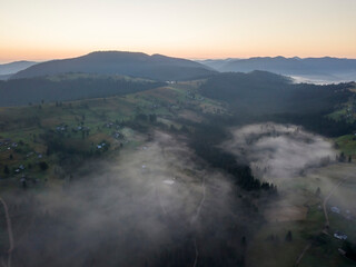 Morning fog in the Ukrainian Carpathians. Aerial drone view.