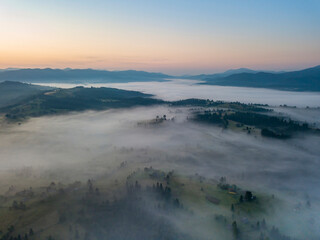 Morning fog in the Ukrainian Carpathians. Aerial drone view.