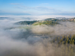 Morning fog in the Ukrainian Carpathians. Aerial drone view.