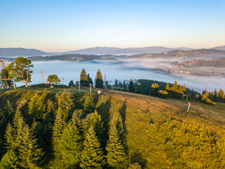 Fog in the Ukrainian Carpathians in the morning. Aerial drone view.