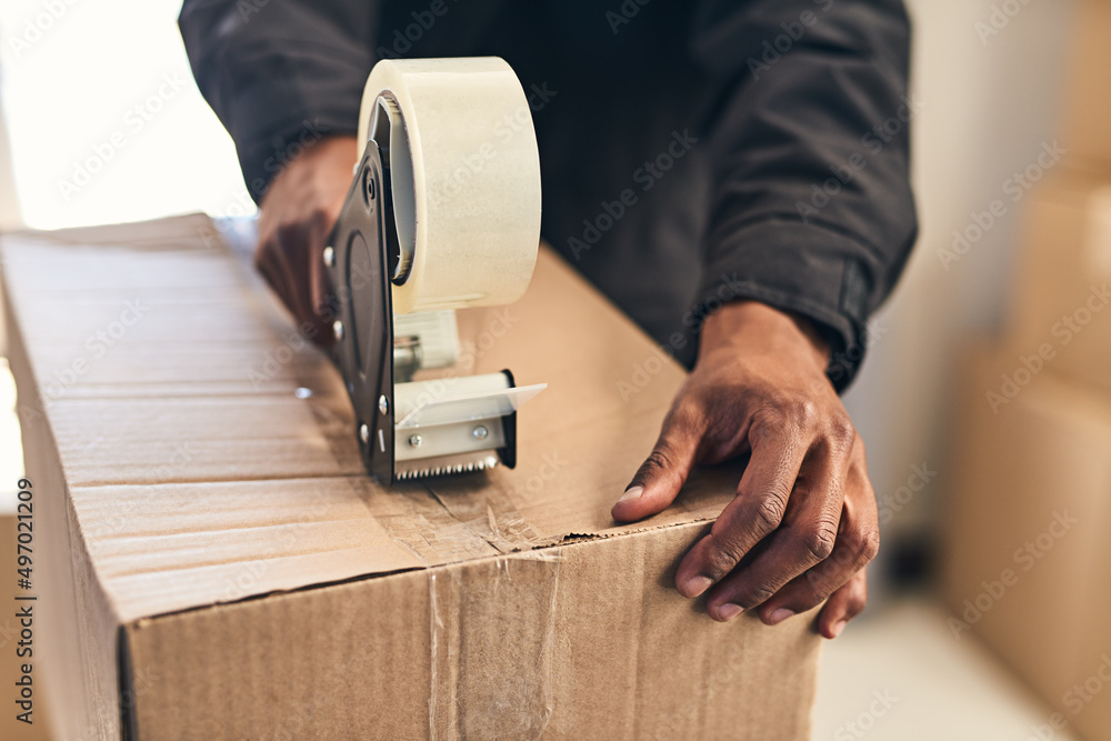 Aufkleber we take every step to protect your package. closeup shot of an unrecognizable courier sealing a box 