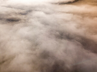 Morning mist in Ukrainian Carpathian mountains. Aerial drone view.