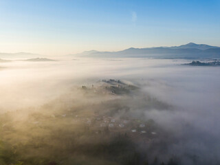 Morning fog in the Ukrainian Carpathians. Aerial drone view.