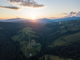 Sunset over the mountains in the Ukrainian Carpathians. Aerial drone view.