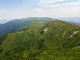 High mountains of the Ukrainian Carpathians in cloudy weather. Aerial drone view.