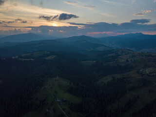 Sunset over the mountains in the Ukrainian Carpathians. Evening. Aerial drone view.