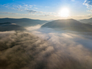 Sunrise over the fog in the Ukrainian Carpathians. Aerial drone view.