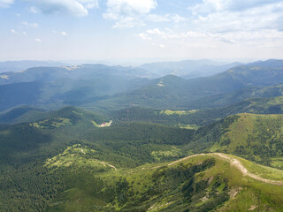 High mountains of the Ukrainian Carpathians in cloudy weather. Aerial drone view.