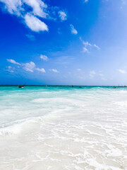 Paradise beach with blue water and boats, Indian Ocean beach in Zanzibar