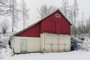 a red shed on a snowy day